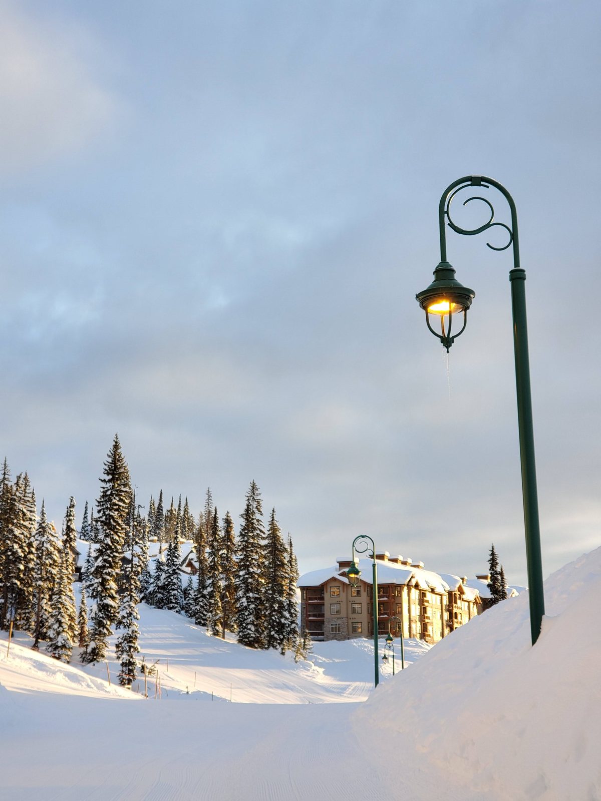 A ski village lamppost at golden hour